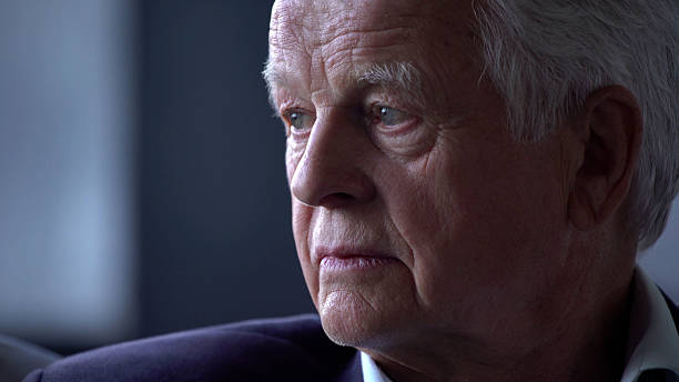 istock Close up portrait of senior man with restless and sad expression 2203216378