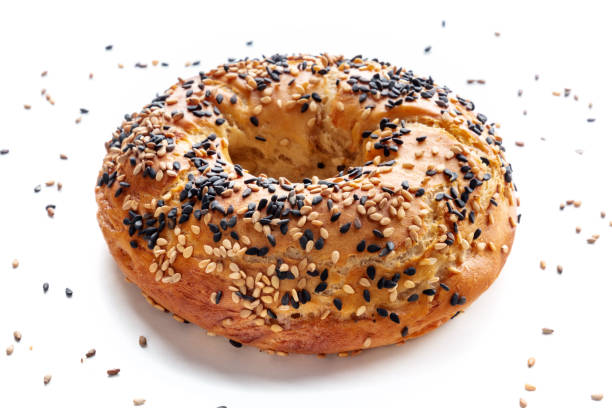 istock Bagel with sesame seeds, on a white background 2203217015