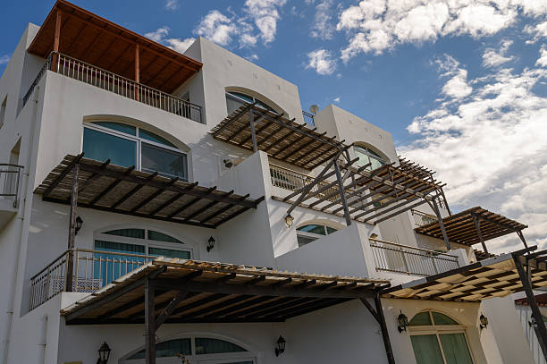 istock Coastal architecture showcases white facades and open terraces under a bright blue sky near the beach 2203218006