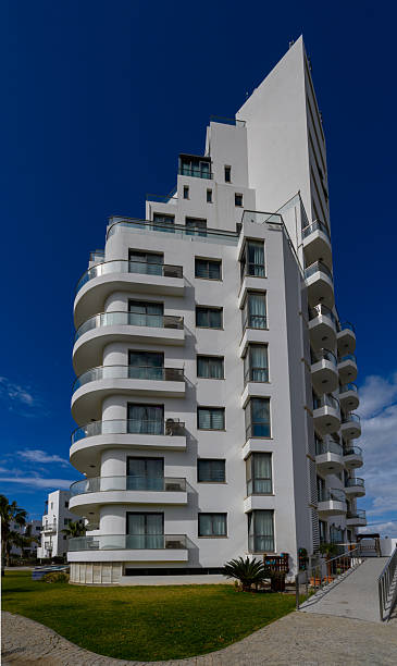 istock Modern architecture shines under a clear blue sky at a coastal location during a sunny afternoon 2203218032