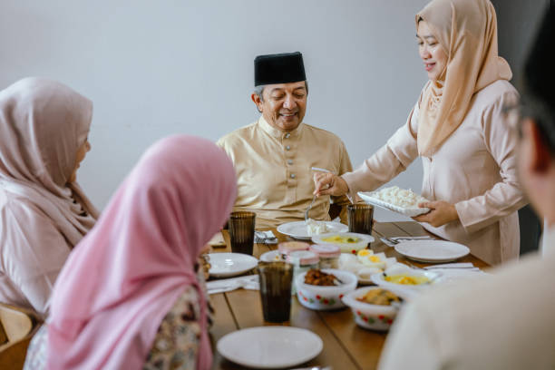 istock Eid Blessings: A Moment of Sharing at the Dining Table 2203218092