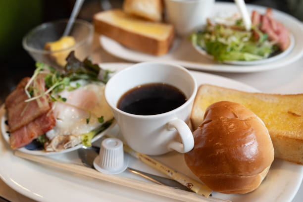 istock Enjoy a snack and coffee at a coffee shop 2203218683