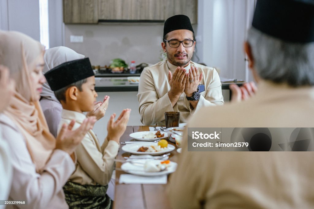 Hari Raya Generosity A Moment Of Gratitude Praying Before The Hari Raya Feast Stock Photo ...