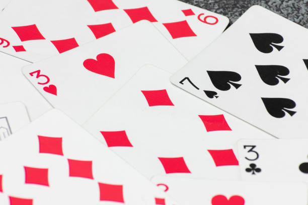 Heap of playing cards on the table.