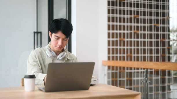 istock A Young Asian man working or Online learning with a laptop in a co-working space 2203222309