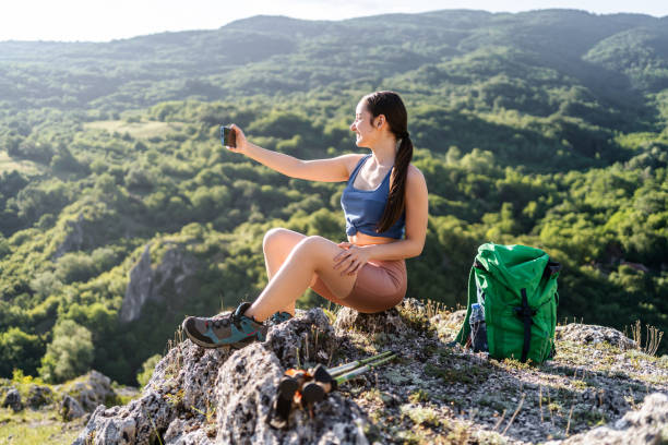 istock Hiker woman taking selfie in nature 2203222580