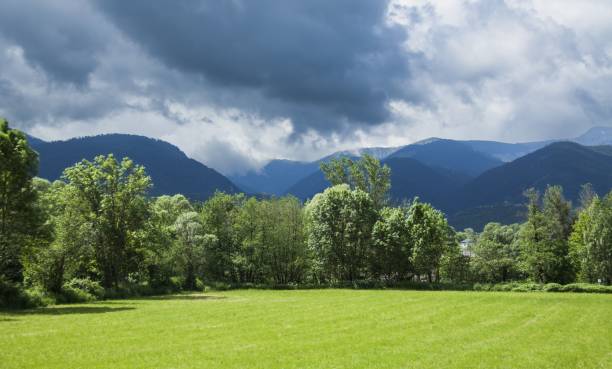 istock Cerdanya between stormy clouds and sunny meadows 2203224975
