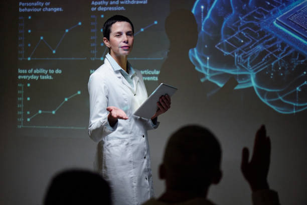 istock Female Scientist Speaking at Conference 2203229426