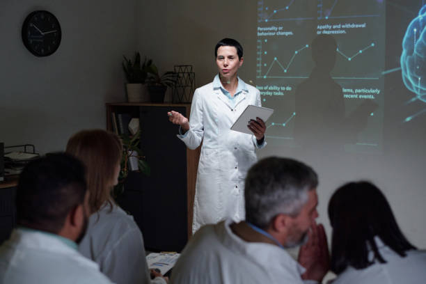 istock Female Doctor Giving Presentation 2203229494