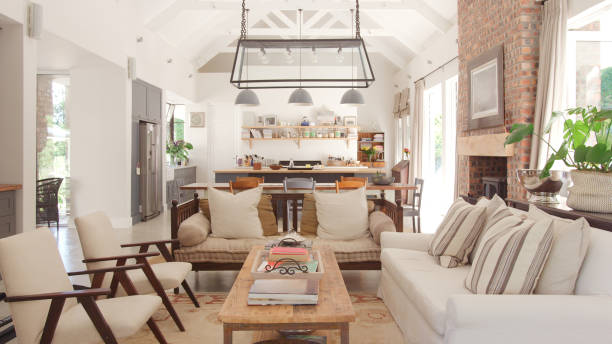 istock Interior Of Stylish Modern Open Plan Home With Kitchen Dining Room And Seating Area With No People 2203229737