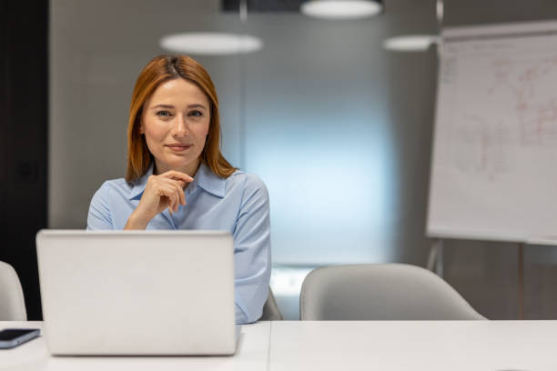 istock Businesswoman working on laptop in modern office 2203233823
