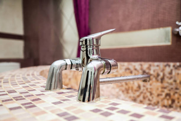 metal water mixer tap in luxury bathroom.