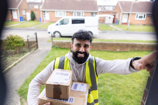 istock Delivery Driver at Smart Doorbell 2203234866