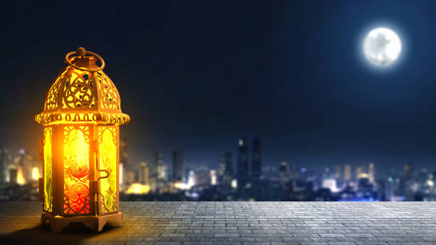 istock Traditional glowing Arabic lantern with cityscape on the night background. Copy space. Concept of Religion, Spiritual or Ramadan 2203236330