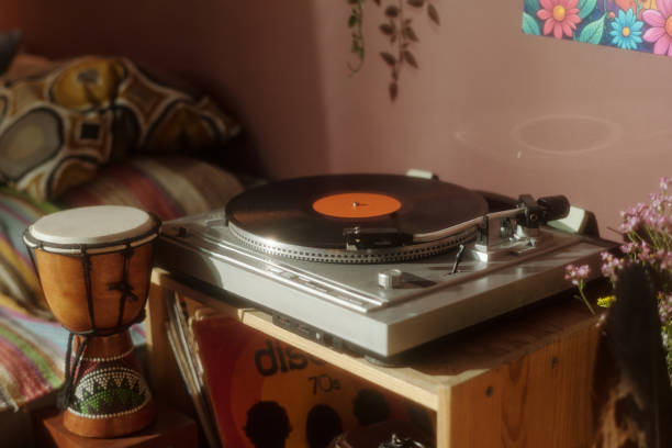 istock Experiencing Vinyl Records on a Turntable in Cozy Room 2203238037