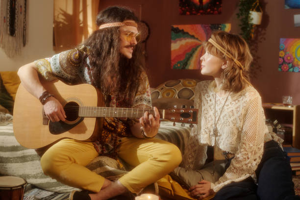 istock Playing Acoustic Guitar in Warm Cozy Atmosphere 2203238119
