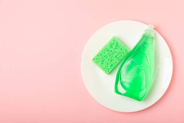 istock Colorful dish sponges on textured background. Kitchen sponge. Cleaning concept, cleaning service. Dishwashing liquid with clean and dirty dishes plate. Place for text, copy space. Wash the dishes. 2203240068