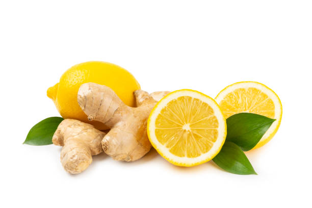 istock Fresh ginger and lemon isolated on white background. Sliced ​​ginger. Ginger root. Traditional alternative medicine, healing tea for immunity. Close-up. 2203243934