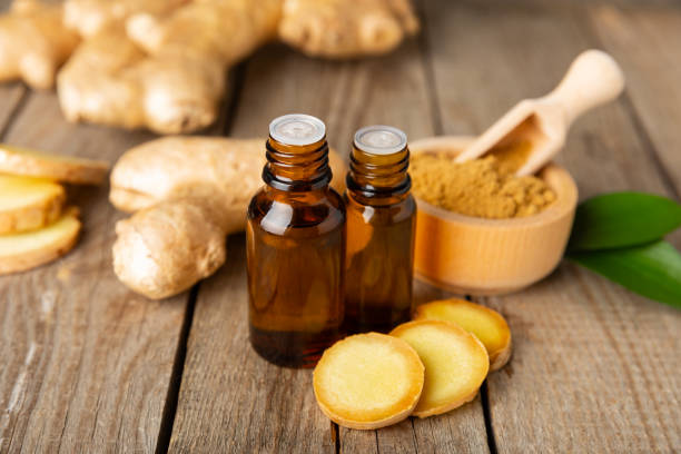 istock Ginger essential oil on texture background. Fresh ginger slices. Essence, serum, oil. Alternative medicine. Phytotherapy. Health and beauty concept. Place for text. Copy space. 2203244097