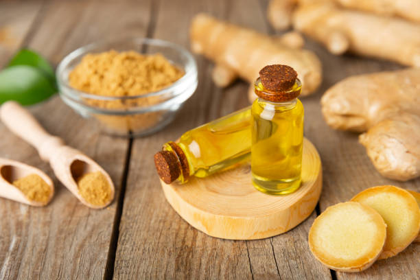istock Ginger essential oil on texture background. Fresh ginger slices. Essence, serum, oil. Alternative medicine. Phytotherapy. Health and beauty concept. Place for text. Copy space. 2203244098
