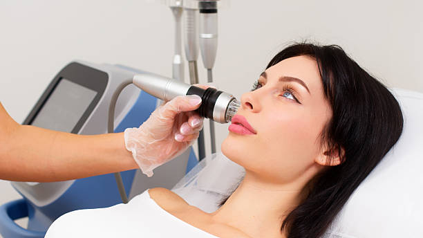istock A woman undergoes cosmetic procedures using a bbl laser. 2203244919