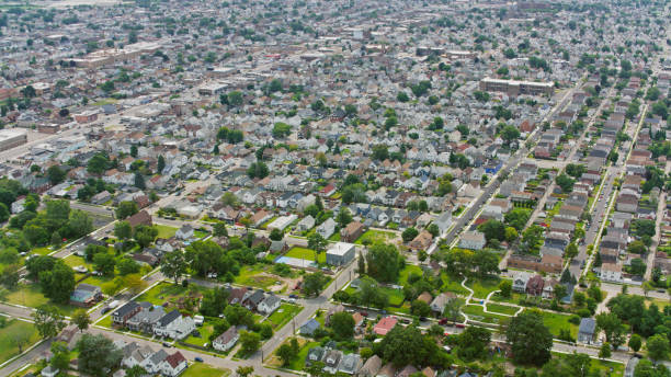 istock Aerial View of Lansing Michigan Suburbs with Tree-Lined Streets 2203245413