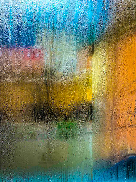 Raindrops on the glass in the late evening