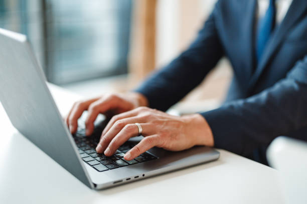istock Businessman Working on Laptop in Office Environment 2203246516