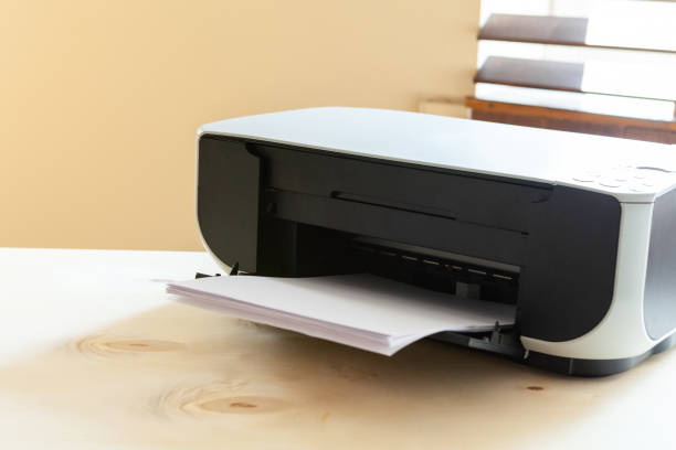 istock Close up of an office table with printer on it 2203249617