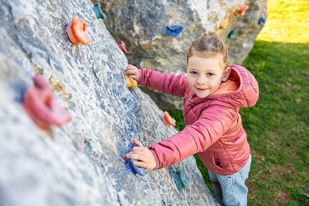 Girl climbing the wall