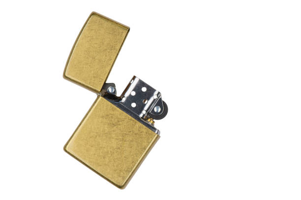 istock Brushed brass lighter isolated on white background. Fuel windproof lighter with open cap. 2203252621