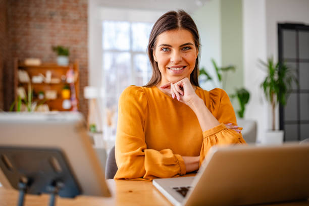 istock Young woman enjoying her cozy home office while contemplating her next project 2203255088