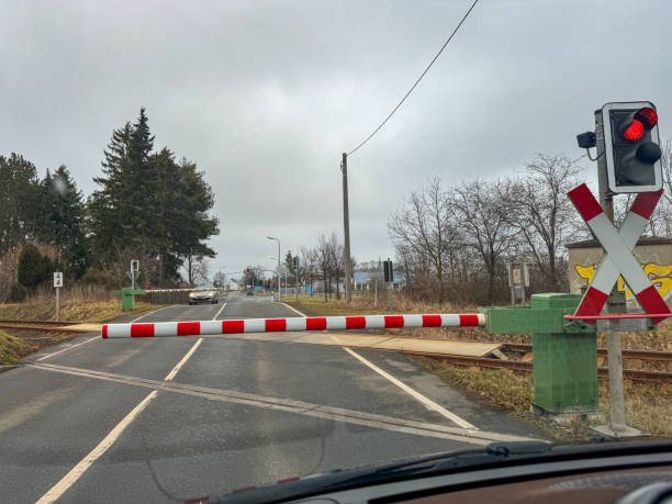 istock traffic light on the road with a railway crossing in Germany 2203256328