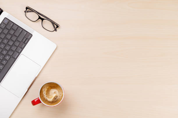 istock A clean and minimal desk setup featuring a laptop and a coffee cup 2203257611
