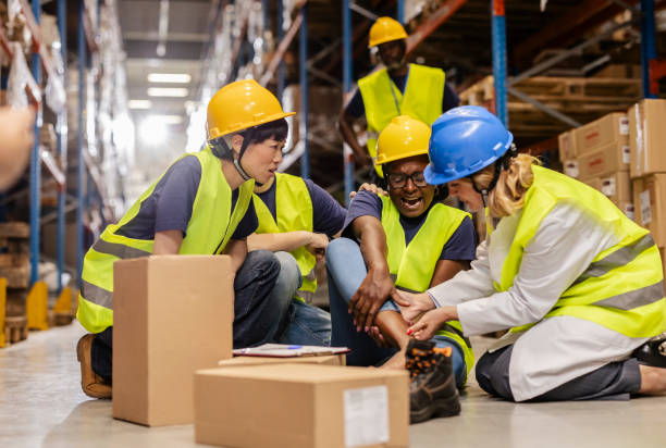 istock Doctor assisting injured warehouse worker after accident 2203257774