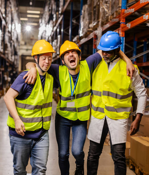 istock Warehouse workers helping injured colleague after accident 2203257778