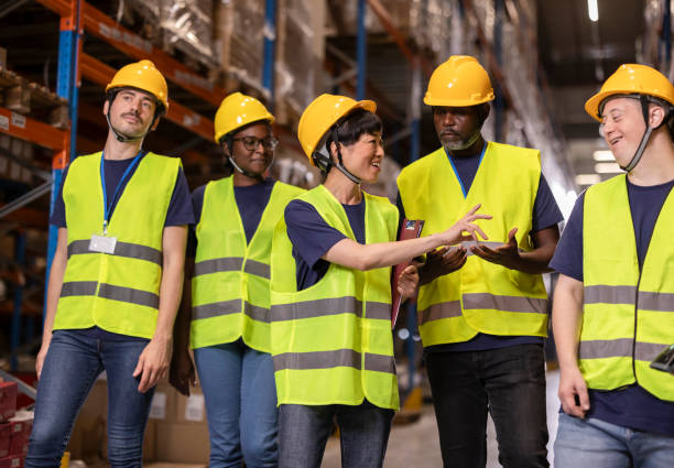 istock Warehouse workers discussing logistics and inventory management 2203257813