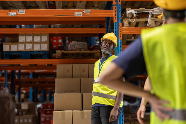 istock Warehouse workers discussing logistics and inventory management 2203257875