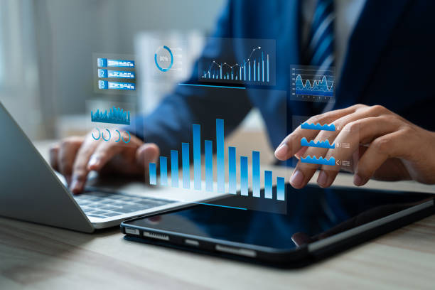 istock Businessman analyzing sale data and financial growth charts using tablet for strategic market planning and development.Innovative,Solutions,Integrating data analytics and AI technology,Market research 2203258477