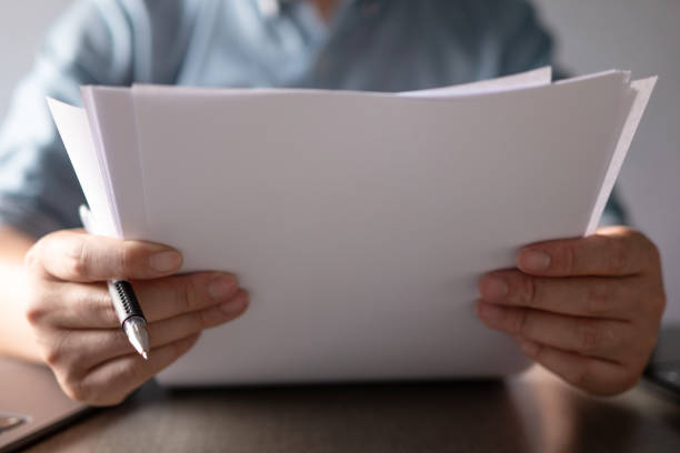 istock asian businessman writing on white paper 2203258734