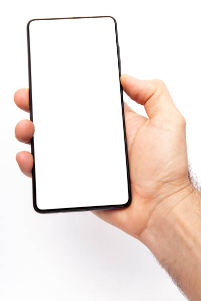 istock Mobile phone on white background. Hand holding mobile phone on white background. 2203259511