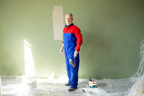 istock The walls are being painted by the house painter 2203261155