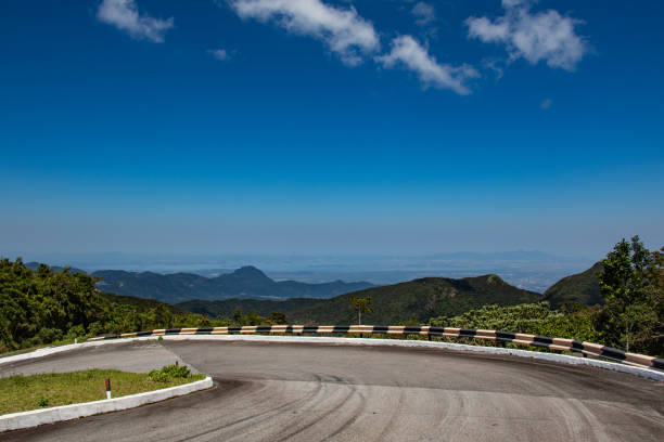 View of twisted road climbing on a hill.