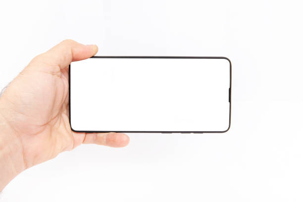 istock Mobile phone on white background. Hand holding mobile phone on white background. 2203262991