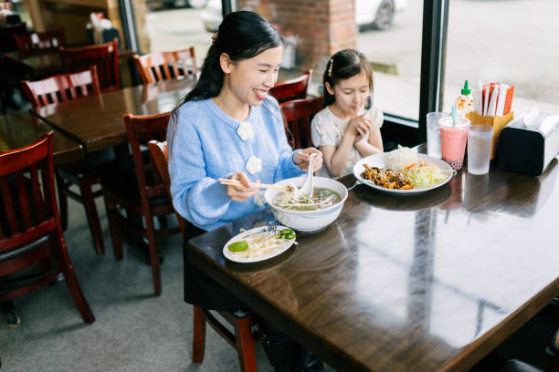 istock Mother Daughter Lunch Date for Pho 2203263295