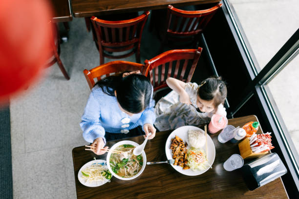istock Mother Daughter Lunch Date for Pho 2203263477
