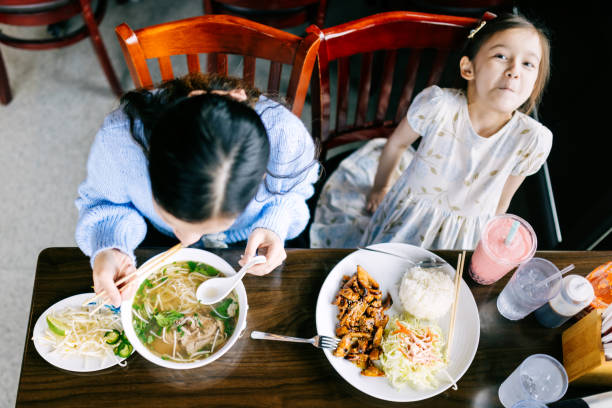 istock Mother Daughter Lunch Date for Pho 2203263479