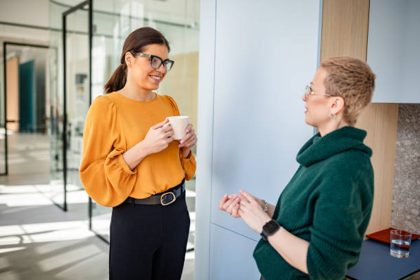 istock Young women engaged in a collaborative discussion in a modern office setting during the workday 2203263882