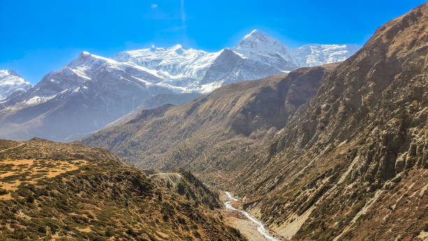 istock Snowy mountain peaks on the horizon. 2203265839