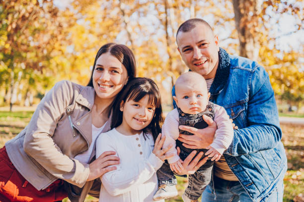 istock Happy family enjoy in park 2203266064